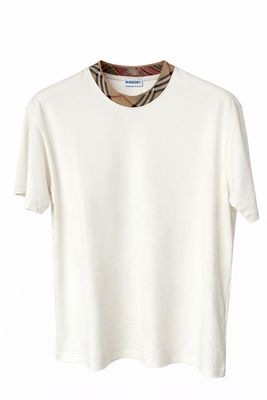 Burberry cream luxury men’s t-shirt with signature check collar detail front view studio product image