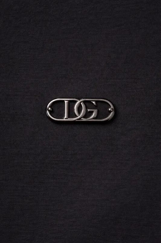 Dolce Gabbana DG metal logo close up on black designer crew neck t shirt
