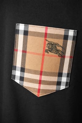 Burberry check pocket close-up detail on black men's luxury designer t-shirt with embroidered logo