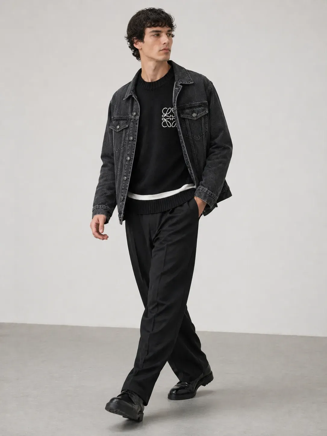 loewe black anagram knitted sweater men walking pose model denim jacket layered luxury outfit style