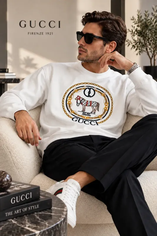 gucci white embroidered sweatshirt men seated model wearing equestrian horse and gold chain design