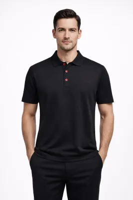Kiton Napoli black polo shirt on male model with signature red buttons straight pose
