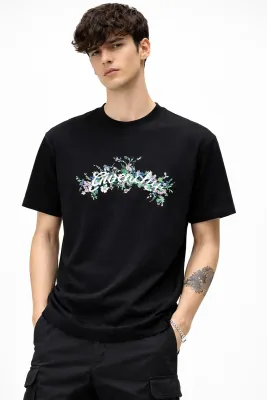 Givenchy black men's t-shirt with floral embroidered front logo on model
