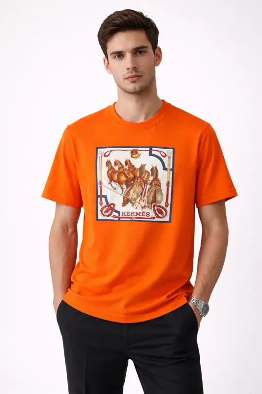 Male model wearing Hermes orange equestrian designer mens tee in front pose