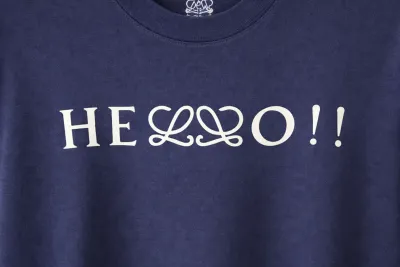 Loewe navy blue men’s t-shirt hello print logo close-up detail view