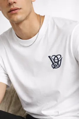 Valentino minimal logo embroidered tee mens premium editorial chest crop image