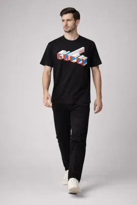 Gucci graphic logo black tee men walking pose full body model view