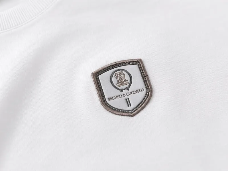 brunello cucinelli minimal logo white t shirt men logo close up embroidered badge premium detail