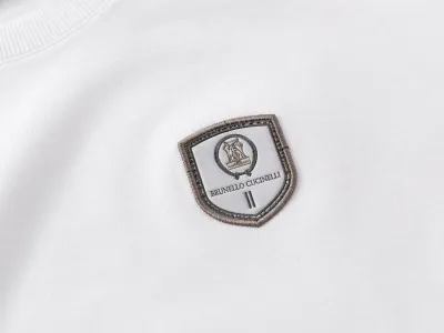 brunello cucinelli minimal logo white t shirt men logo close up embroidered badge premium detail