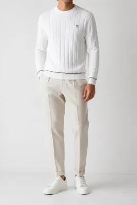 brunello cucinelli white knit sweater men model front fit with metallic chest emblem