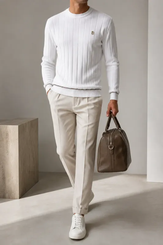 brunello cucinelli white knit sweater men walking model with ribbed texture and metallic chest emblem