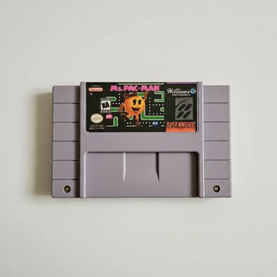Ms. Pac-Man Super Nintendo cartridge with pink and black label