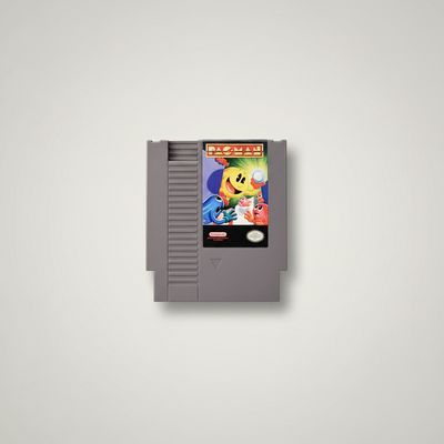 Front profile of a gray Nintendo NES game cartridge for Pac-Man