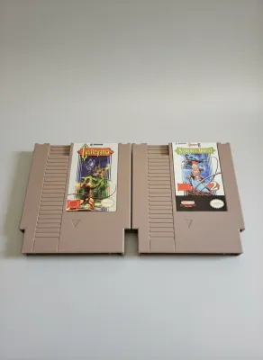 Two Castlevania and Castlevania II Simon's Quest NES game cartridges displayed together