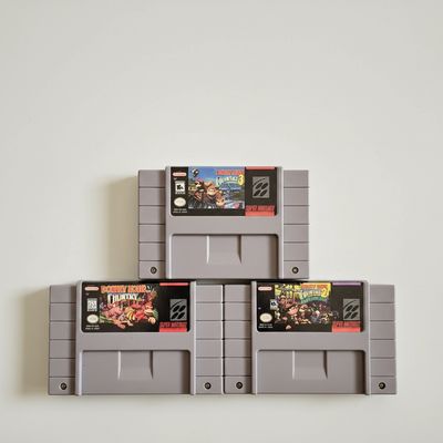 Donkey Kong Country Games 1, 2, & 3 (SNES) Front labels of Donkey Kong Country Super Nintendo game cartridges