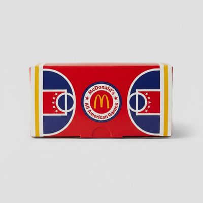 Close-up detail of McDonald’s All American Games Crocs Happy Meal Box showing surface, edges and wear.