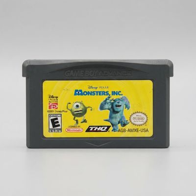 Front of a Disney Pixar Monsters, Inc. Game Boy Advance cartridge with Mike and Sulley on a yellow label