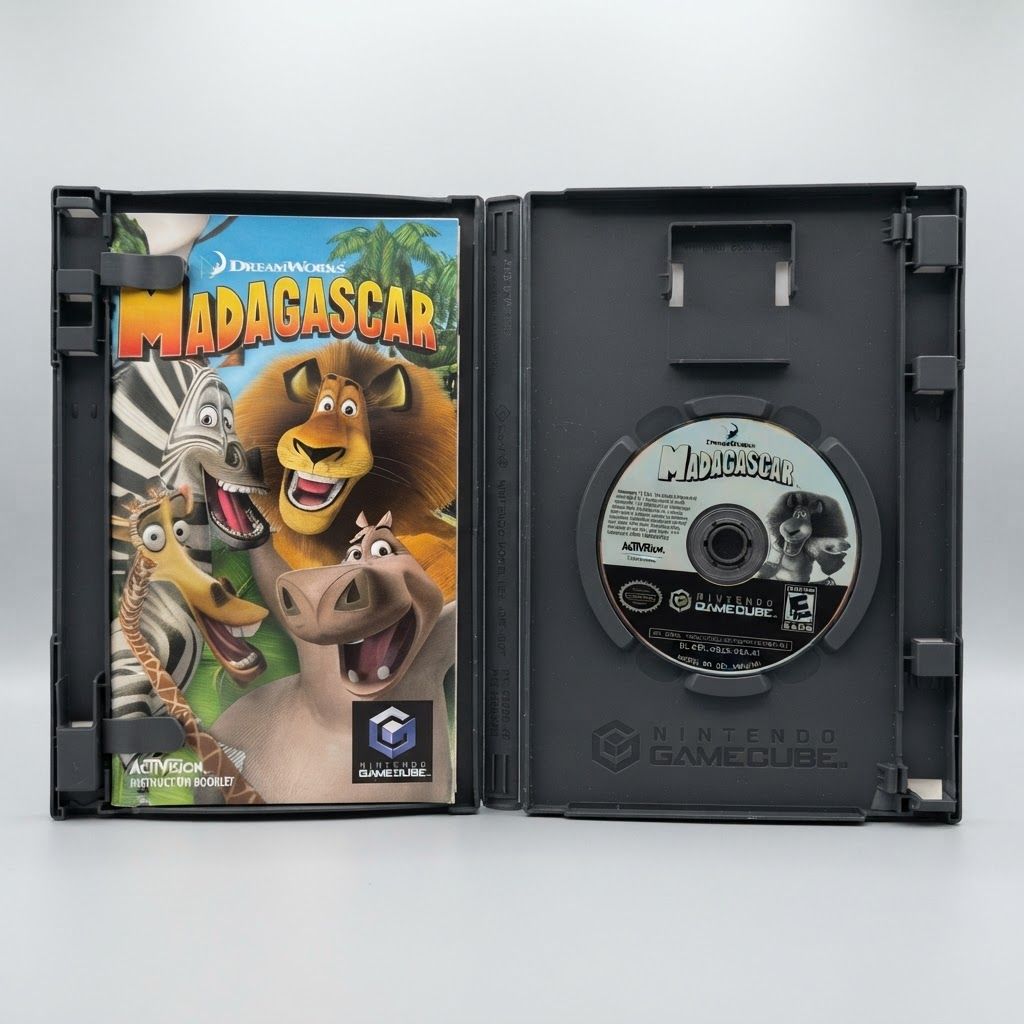 Open black case for Madagascar on Nintendo GameCube showing the colorful instruction booklet and game disc