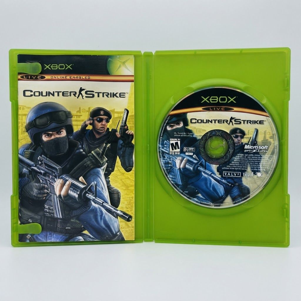Counter-Strike for Xbox shown in an open green case with the game disc and manual featuring tactical soldiers