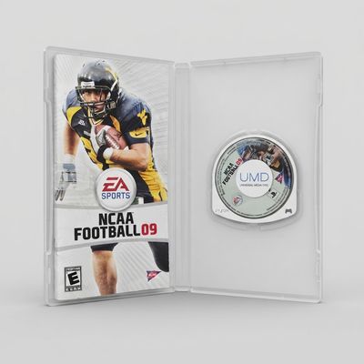 Open clear case for a complete EA Sports NCAA Football 09 on PSP showing the yellow and blue manual and UMD disc