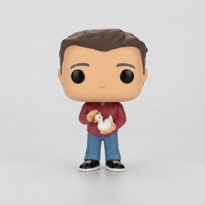Front view of a loose Funko Pop! Friends - Joey Tribbiani figure holding a white duck, wearing a red shirt and blue jeans