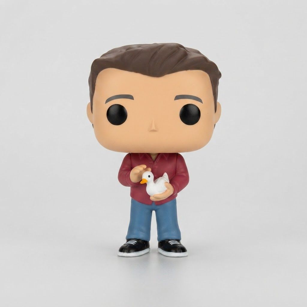 Front view of a loose Funko Pop! Friends - Joey Tribbiani figure holding a white duck, wearing a red shirt and blue jeans