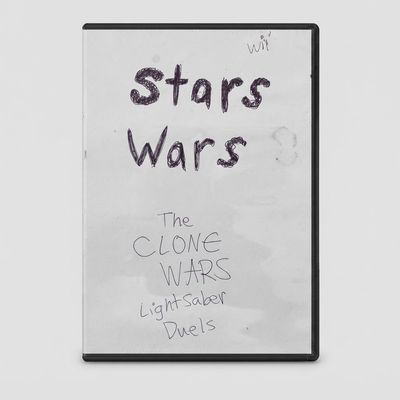 Front of Star Wars: The Clone Wars Lightsaber Duels for Nintendo Wii with handwritten title art on a white paper insert