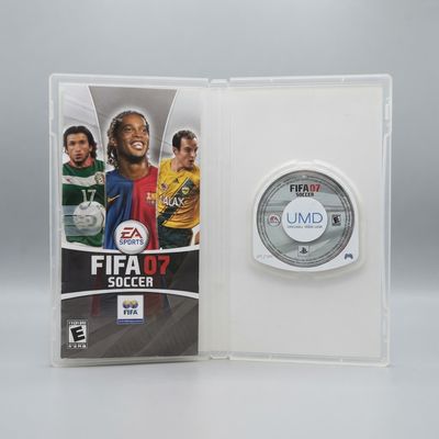 Inside view of EA Sports FIFA 07 Soccer for PSP showing the manual and UMD disc in an open clear case