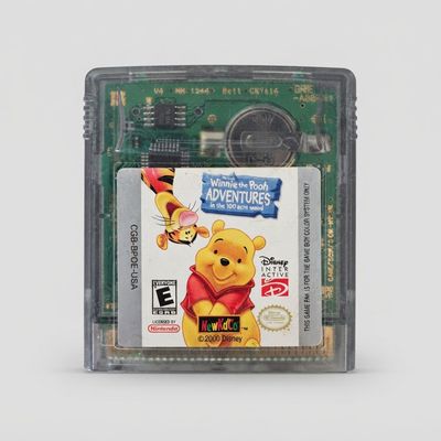 Front view of Disney's Winnie the Pooh: Adventures in the 100 Acre Wood for Game Boy Color on a clear gray cartridge