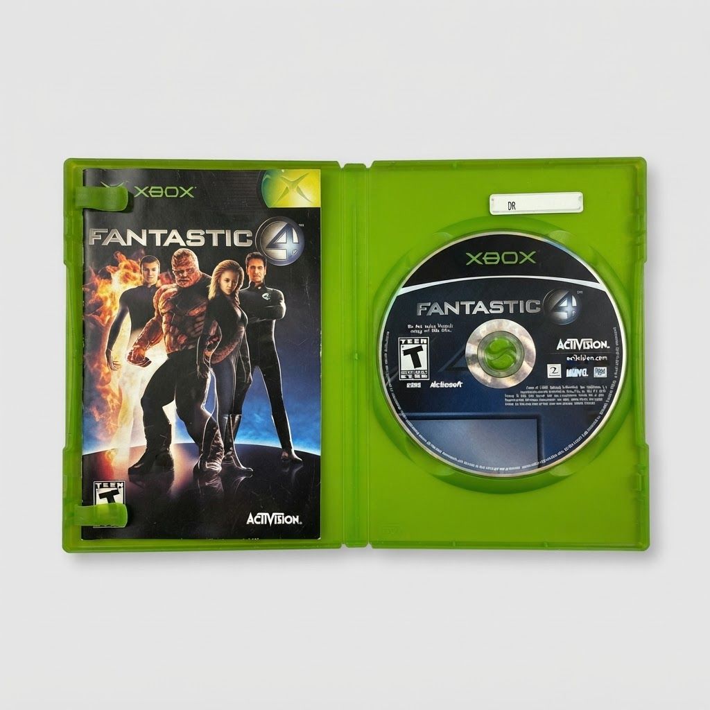 Open green case of Fantastic 4 for Xbox showing the game manual on the left and disc on the right