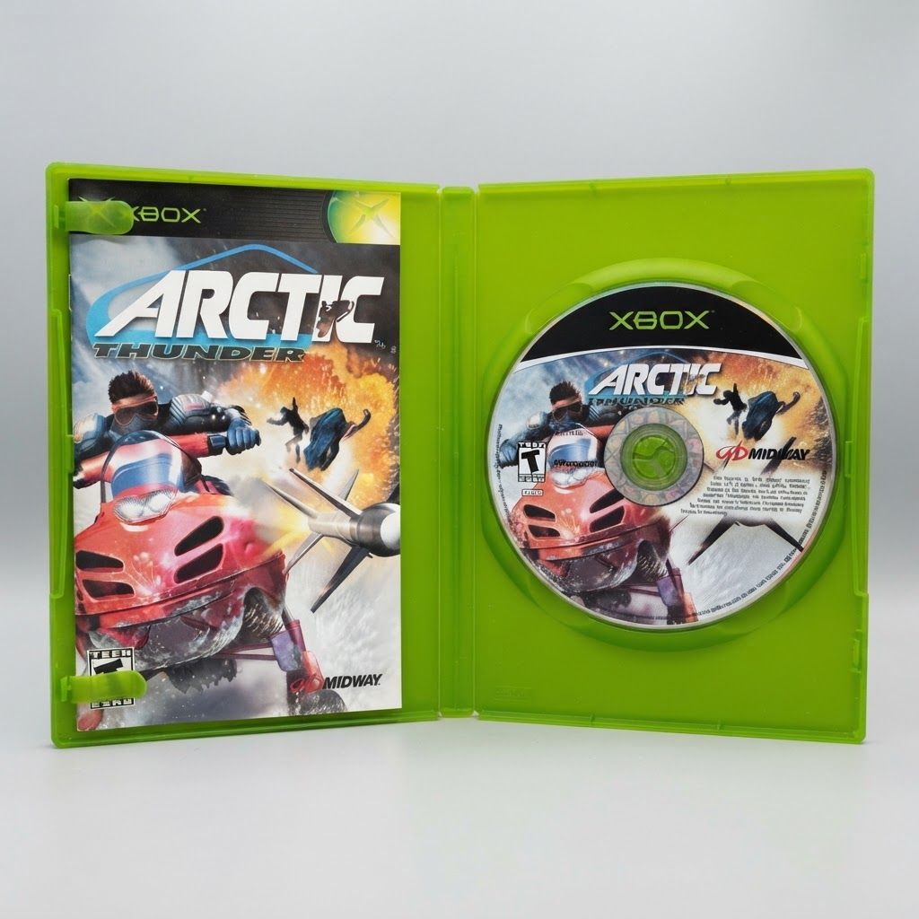 Open green case showing the Arctic Thunder Xbox game disc and instruction manual