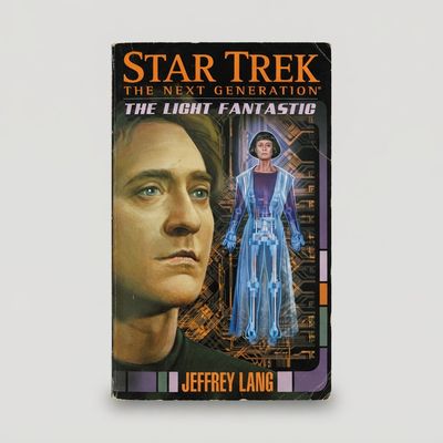 Front cover of the Star Trek: The Next Generation vintage paperback The Light Fantastic with illustrations of Data