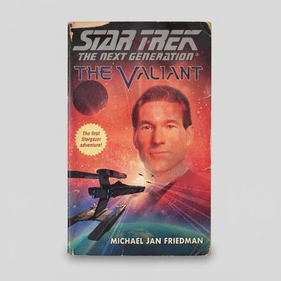 Front cover of the Star Trek: The Next Generation The Valiant vintage paperback with light corner and edge wear