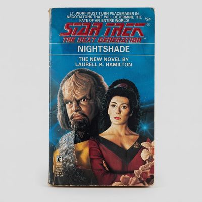 Front cover of the vintage Star Trek: The Next Generation Nightshade paperback featuring Worf and Troi on a blue background