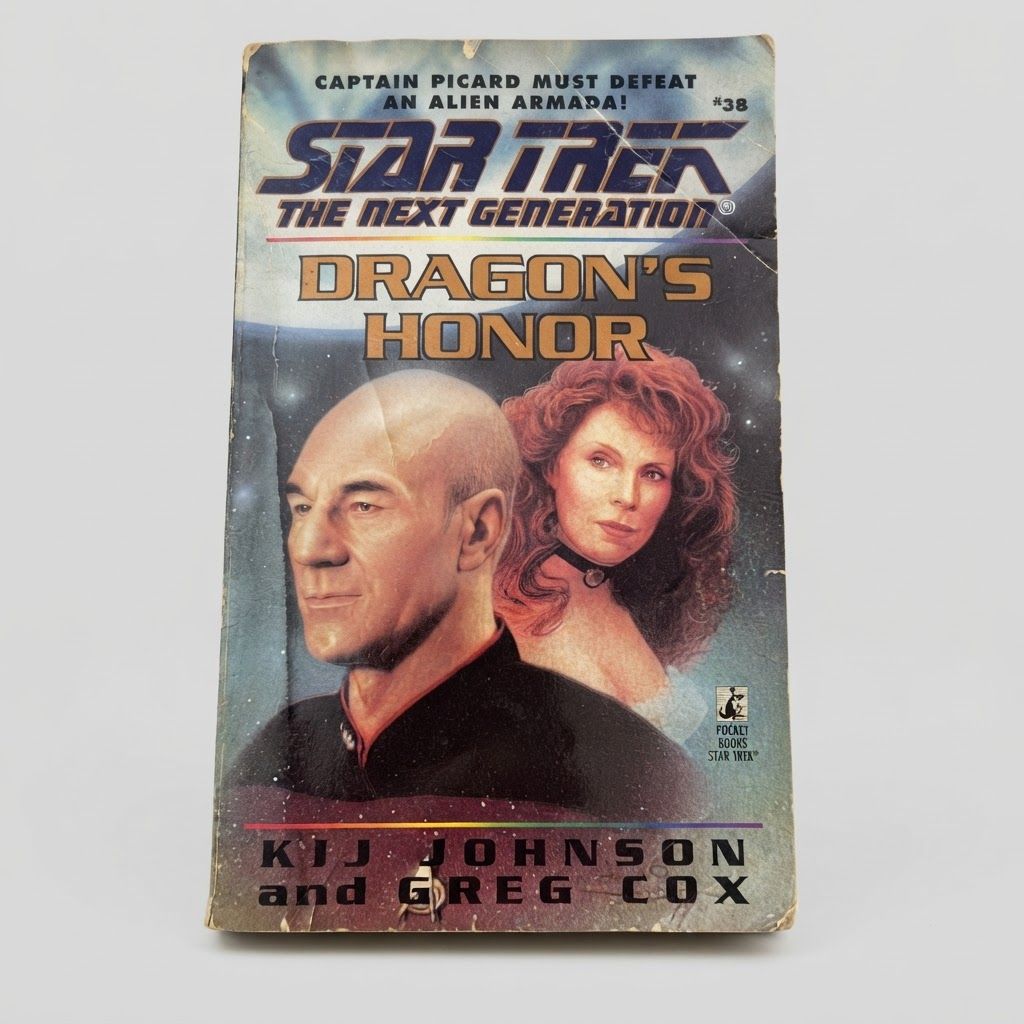 Front cover of the vintage Star Trek: The Next Generation Dragon's Honor paperback featuring characters on a space background