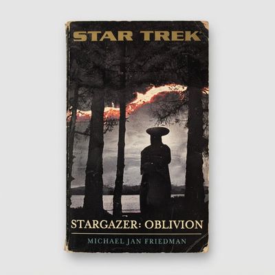 Front cover of the vintage Star Trek: Stargazer Oblivion paperback featuring a dark forest scene with minor edge wear