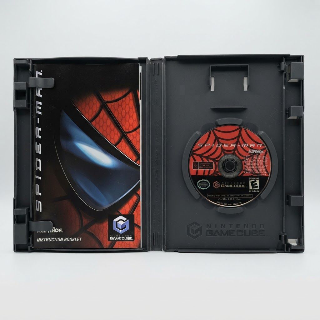 Open case for Spider-Man on GameCube containing the game disc and instruction manual on a white background