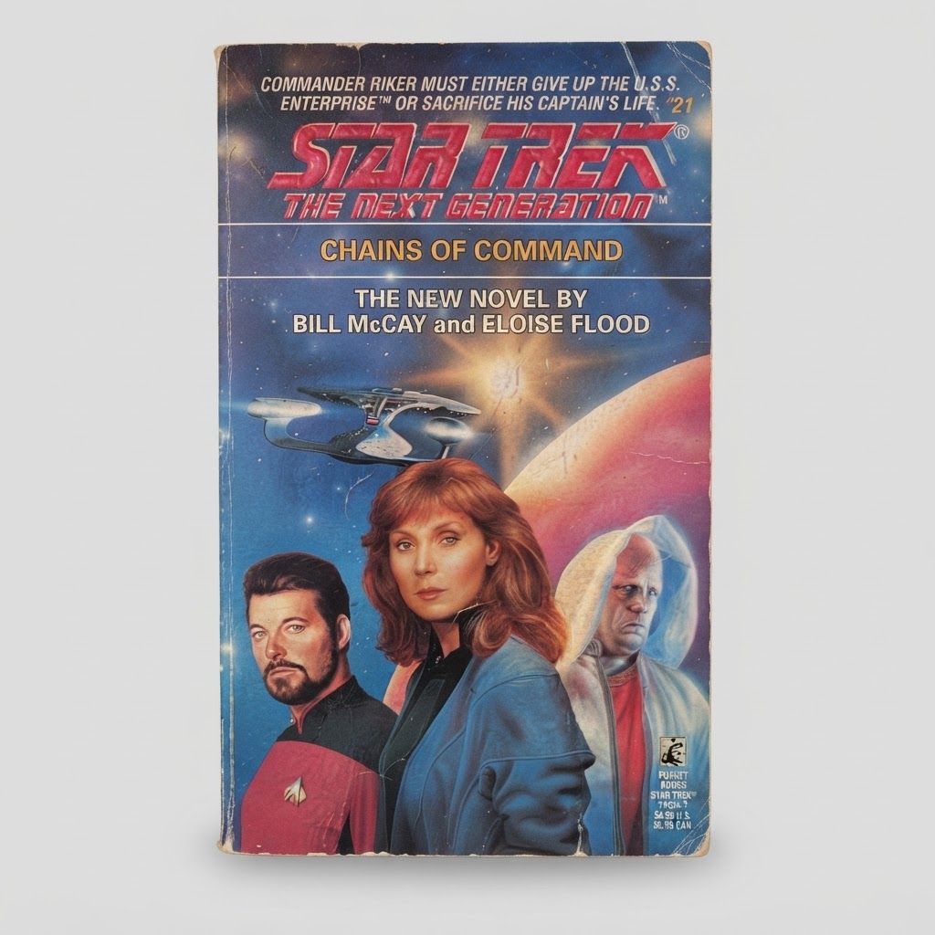 Front cover of the vintage paperback Star Trek: The Next Generation Chains of Command with minor edge wear
