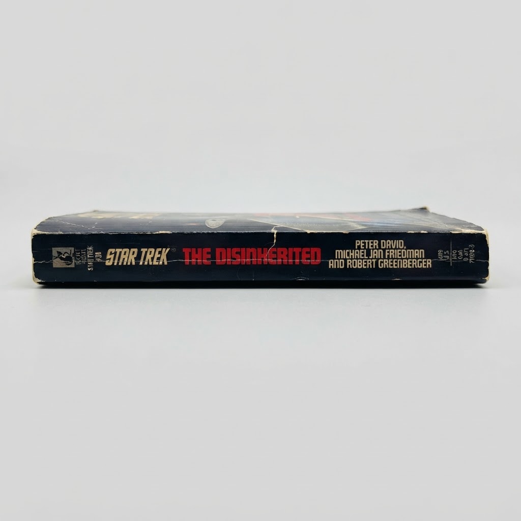 The spine of the vintage Star Trek: The Disinherited paperback book with visible edge wear on a white background