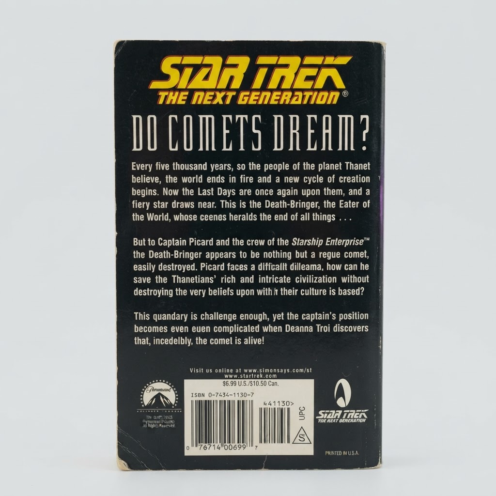 Back cover of the Star Trek: TNG "Do Comets Dream?" vintage paperback featuring a black background and white text