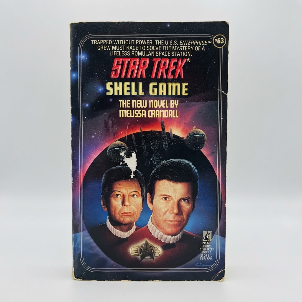 Front cover of Star Trek: The Original Series Shell Game vintage paperback with slight edge wear and a white mark
