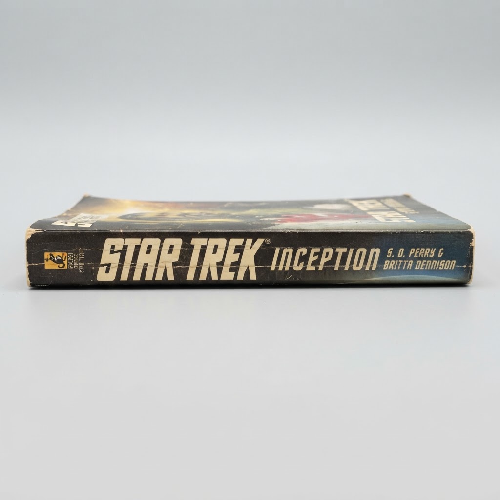 Black spine of the vintage Star Trek Inception paperback book featuring authors S. D. Perry and Britta Dennison