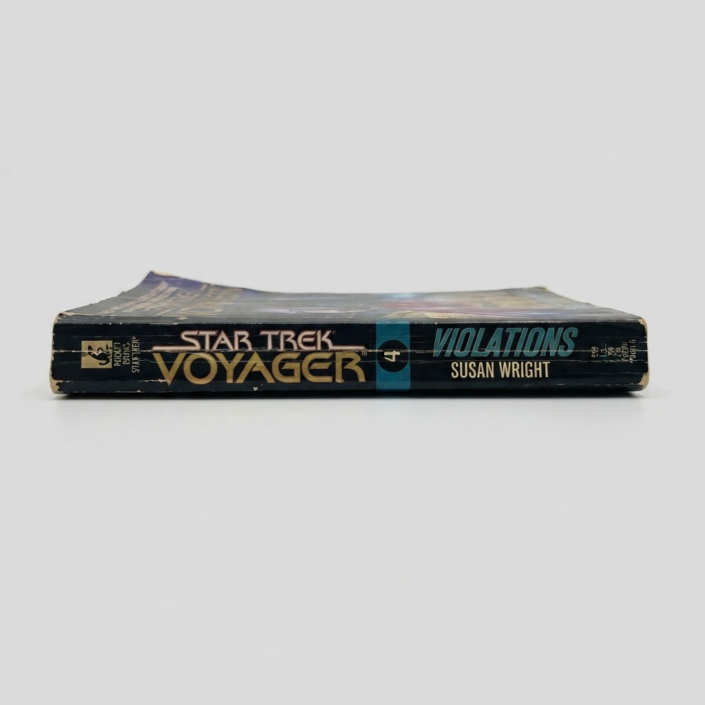 Spine view of the vintage Star Trek: Voyager "Violations" paperback by Susan Wright with visible shelf wear