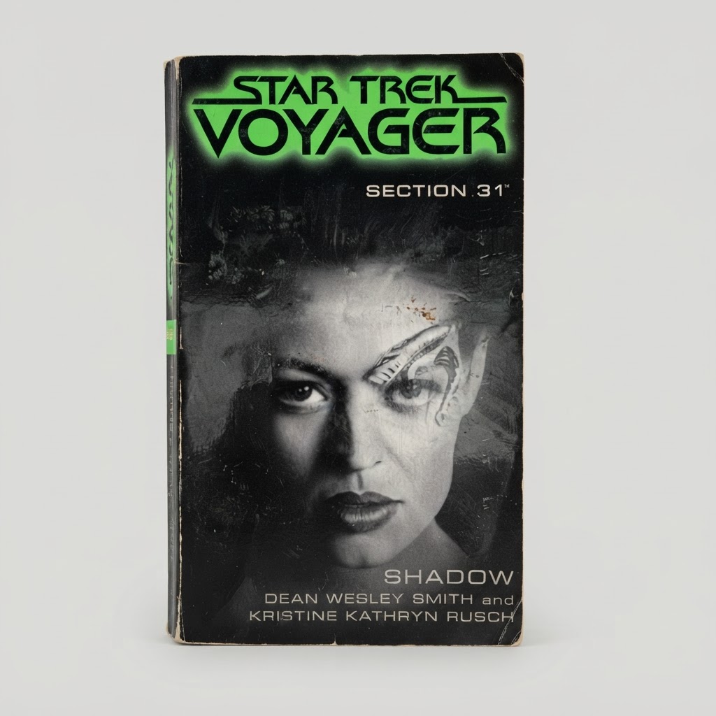 Front view of the vintage Star Trek: Voyager Section 31: Shadow paperback with wear on the black cover edges