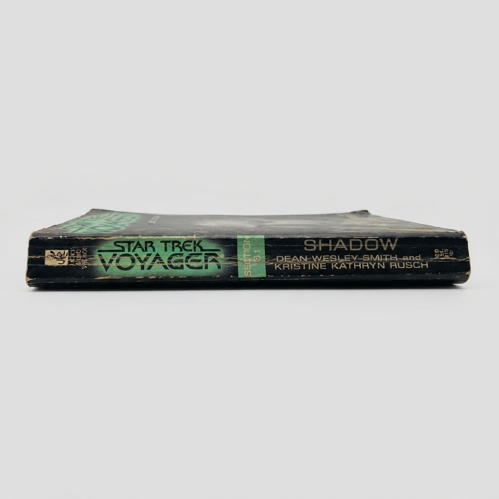 Spine of the Star Trek: Voyager Section 31: Shadow vintage paperback showing wear on the black edges against a white background