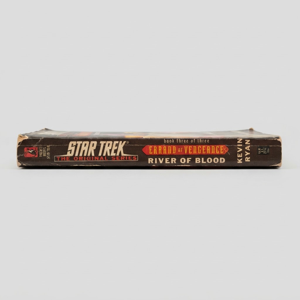 Spine of the Star Trek: Errand of Vengeance "River of Blood" vintage paperback showing edge wear on a black background