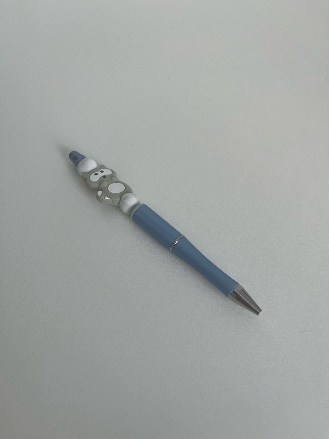 Pen met wasbeer blauw
