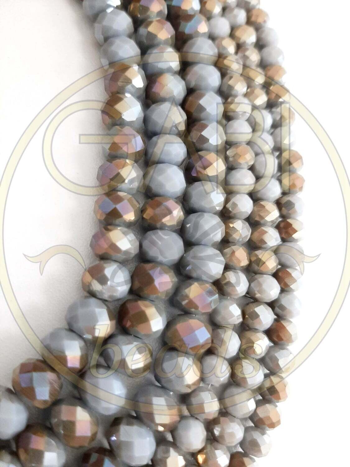 Stiklo kristalai, briaunuoti, rondelės forma, pilkos ir auksinės spalvos, 8x6mm 42cm juosta