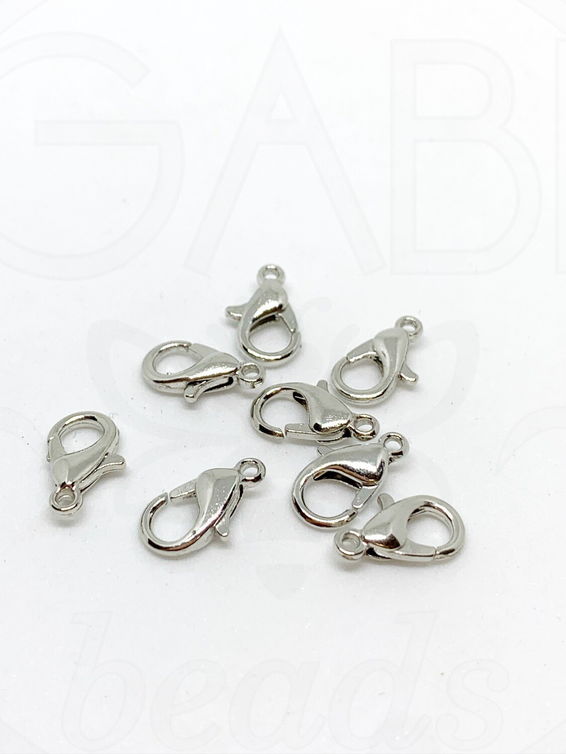 Užsegimai, plieno spalvos, 12x8mm , 25vnt