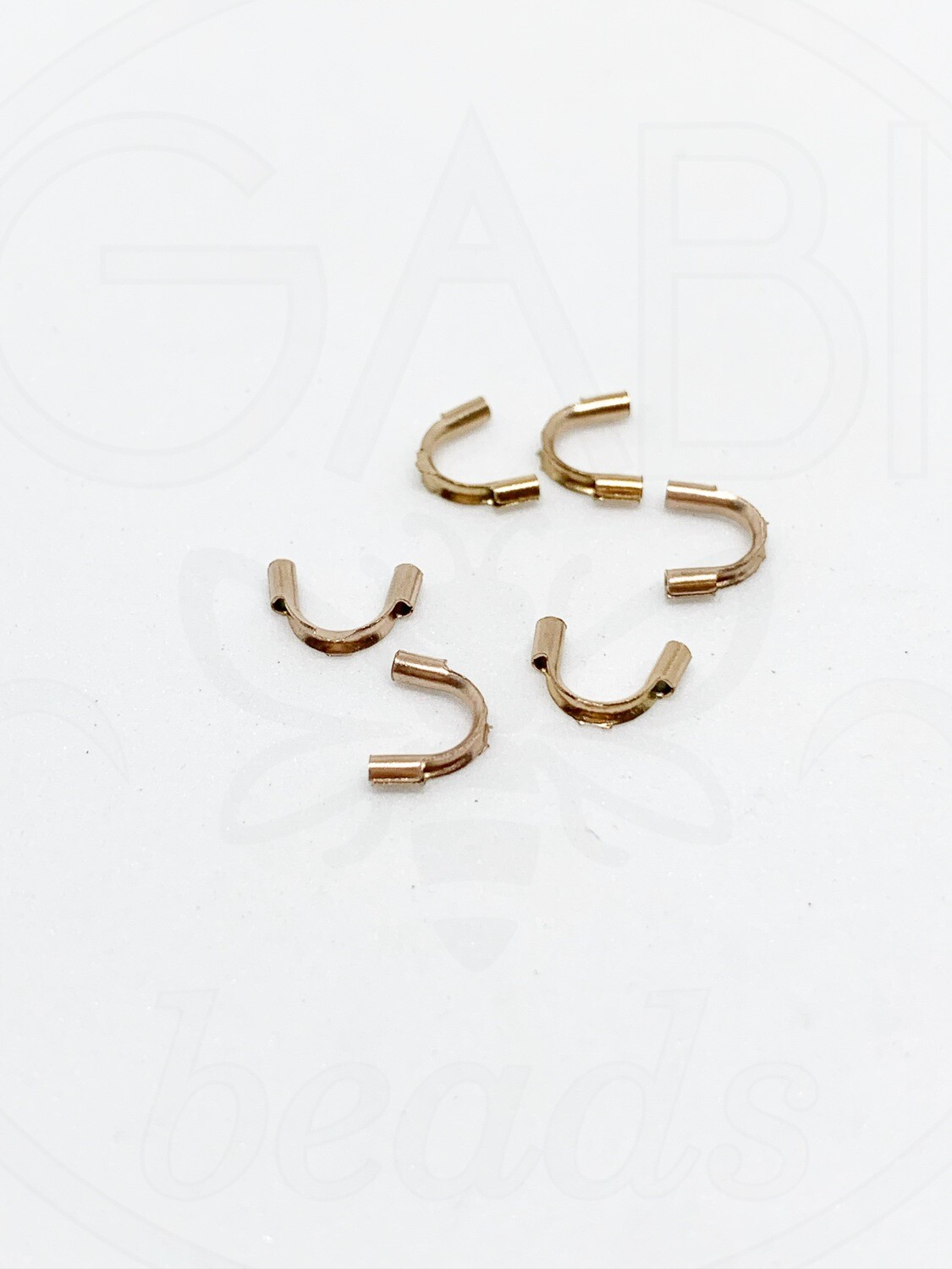 Nerūdijančio metalo pasagėlės, Rose gold spalvos, 6,5 x 5mm, 4vnt